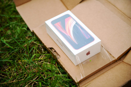 Paris, France - Apr 24, 2020: Side view plastic film over package with new budget iPhone SE by Apple...