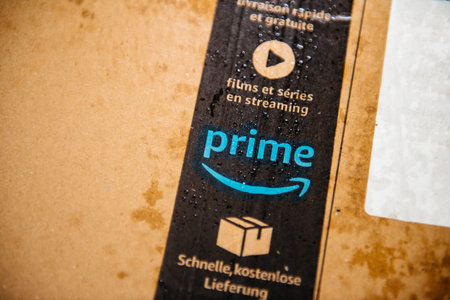 Lyon, France - Aug 7, 2019: Details show on Amazon Prime parcel cardboard with multiple water drops...