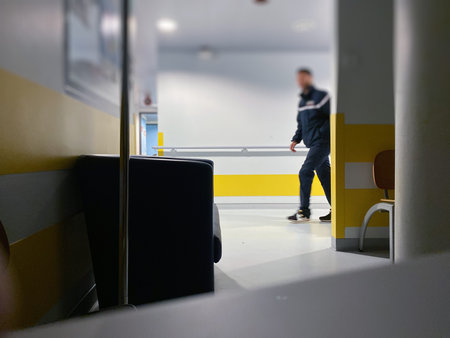 Defocused blur conceptual image of man on hospital corridor during worldwide disease infection by the contagious coronavirus covid-19のeditorial素材