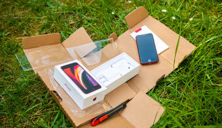 Paris, France - Apr 24, 2020: package with new budget iPhone SE by Apple Computers touch ID, Single-lens rear camera and iPhone 8 design with internals from 11 Pro versionのeditorial素材