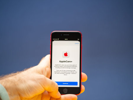 Paris, France - Apr 26, 2020: AppleCare Plus on new budget iPhone SE by Apple Computers touch ID, Single-lens rear camera and iPhone 8 design with internals from 11 Pro versionのeditorial素材