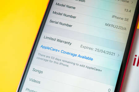 Paris, France - Apr 26, 2020: AppleCare Plus warranty expiring 25 04 2021 on the new budget iPhone SE by Apple Computers touch ID, Single-lens rear camera and iPhone 8 design with internals from 11 Pro versionのeditorial素材