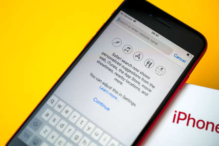 Paris, France - Apr 26, 2020: Safari browser search now shows suggestions from web on new budget iPhone SE by Apple Computers touch ID, Single-lens rear camera and iPhone 8 design with internals from 11 Pro versionのeditorial素材