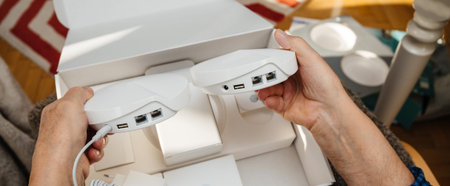 Paris, France - Circa 2020: Senior hands unboxing unpacking new parcel from Amazon Prime containing...