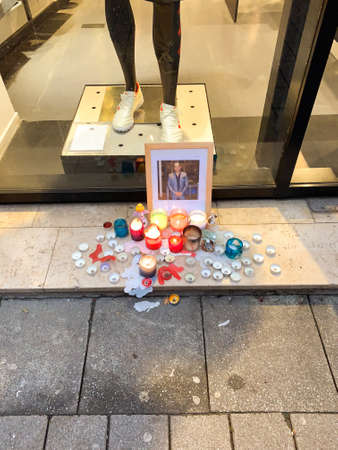 Strasbourg, France - Dec 12, 2018: view of tribute place on Rue des Grande Arcades in central Strasbourg after terrorist attack annual Christmas Market - candles near portrait of one of the victimのeditorial素材