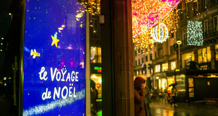 Strasbourg, France - Dec 4, 2020: Christmas travel text on digital signal board display ooh in central Strasbourg during annual christmas market decoration during covid-19 pandemic partial lockdownのeditorial素材