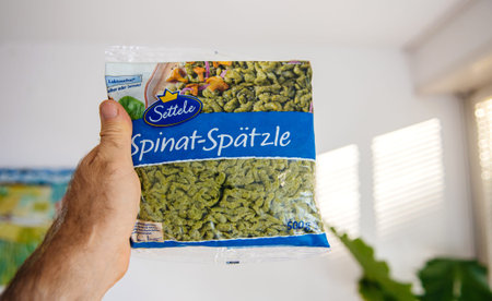 Paris, France - Aug 26, 2020: POV personal perspective at delicious package with german food Spinat...