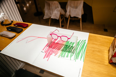 Strasbourg, France - Jan 1, 2021: Optician store with unique designer eyewear eyeglasses presentation in the showcase manufactured by Theo Sees Neonのeditorial素材