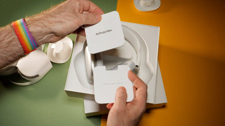 Paris, France - Jan 7, 2020: Reading instruction manual of Apple Computers AirPods Max over-ear...