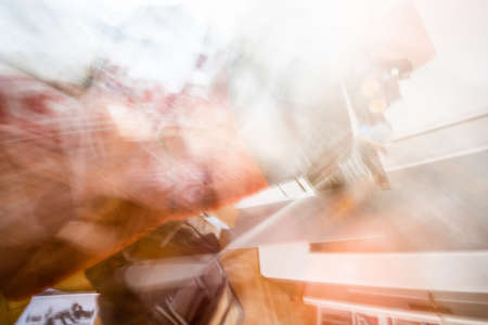 Defocused blurred abstract background of messy room in warm tonesの写真素材