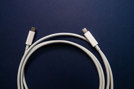USB-C Cable manufactured for fast data and peripheral transmission - isolated on blue background