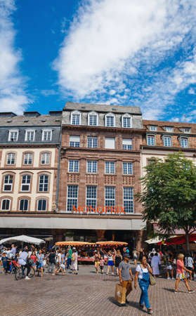 Strasbourg, France - July 29, 2017: Facade of Monoprix store facade during the Grande Braderie street fair annual sale event - life before covid with people customers walking without masksのeditorial素材