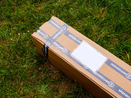 PARIS, France - May 3, 2020: View from above at the cardboard parcel box delivered in back yard from the Contorion tools store located in Germanyのeditorial素材