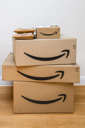 Paris, France - 25 Feb 2021: Stack with multiple sizes of Amazon Prime parcels received in the...