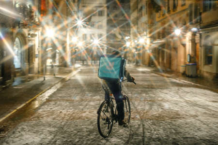 Sparkling light star filter effect over the Deliveroo Rider delivery boyのeditorial素材