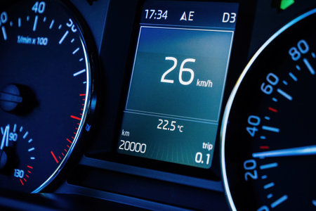 car dashboard computer display with 20000 kilometers mileage