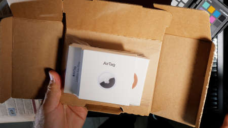 AirTag Unboxing unpacking process finder by Apple Computersのeditorial素材