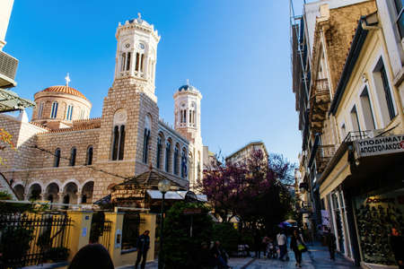 Beautiful day scene with pedestrians and Agia Paraskevi Churchのeditorial素材
