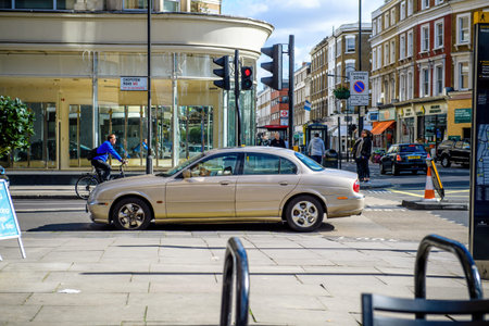 Luxury Jaguar driving on Chepstow Road in city of Westminsterのeditorial素材