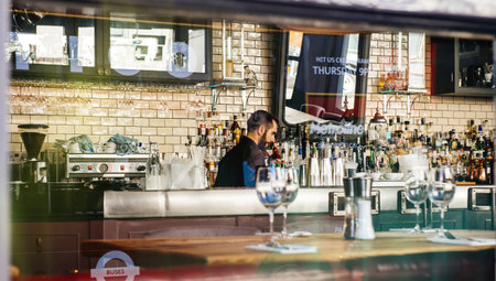 Young man preparing the pub kitchen of a restaurant cafe bar