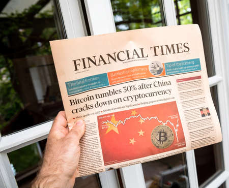 bitcoin reporting down Financial Times newspaper with headline breaking newsのeditorial素材