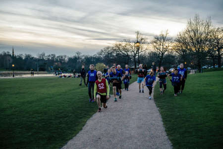 Group of friends sports team participating at a group workout in Hyde Parkのeditorial素材