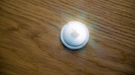 Plastic film protection over AirTag on wooden floorのeditorial素材