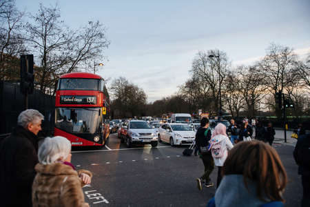 Busy street at dusk in London capital with double decker busのeditorial素材