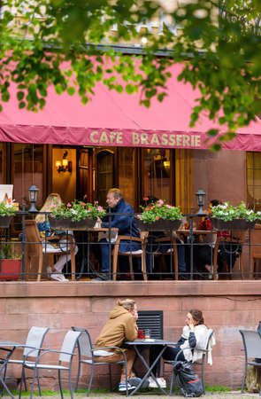 People eating outside at Cafe Brasserie as bars and restaurantsのeditorial素材