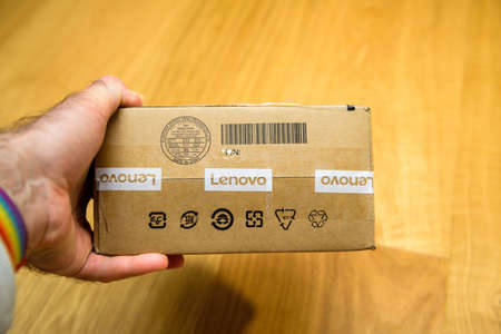 object replacement part with Lenovo Inscription and Security tape red text on itのeditorial素材