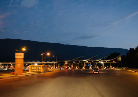 Defocused driver view at the approaching toll road barriers on French highway