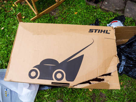 Damaged cardboard of new Stihl electric battery operated lawn mower during unboxingのeditorial素材