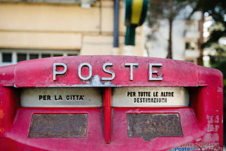 Close-up of Italian public mailbox with Post text and two distinct insertsのeditorial素材