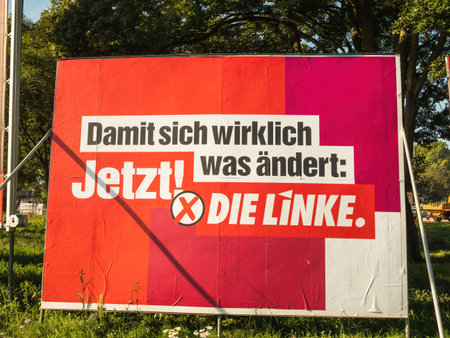 Low angle view red large election poster Die Linkeのeditorial素材