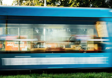 efocused tramway motion with large election posters with the chancellor candidates of SPD with Olaf Scholzのeditorial素材
