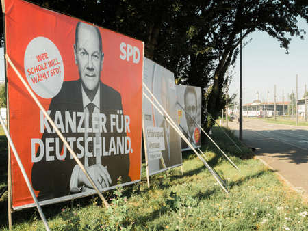 City street with election posters with the chancellor candidates of SPD with Olaf Scholz, CDU with Armin Laschet and Bundnis 90 Die Grunenのeditorial素材