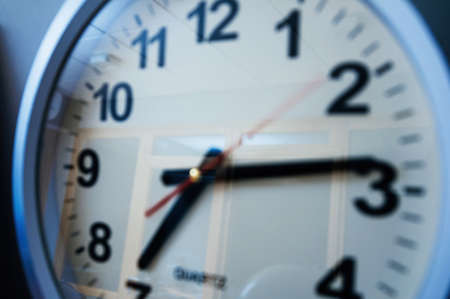 CLose-up of generic wall clock with 7 hours 14 minutesの写真素材