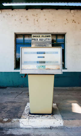 Old gas station in France with text essence sans plombの写真素材