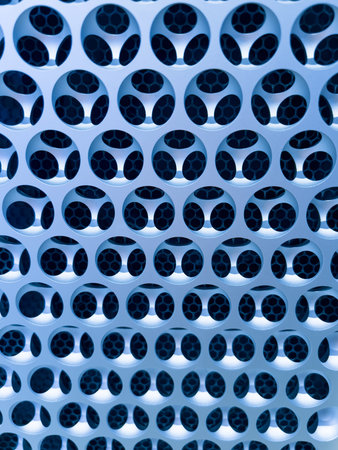 Close-up of air ducts ventilation holes on front aluminum body of Apple Computers Mac pro