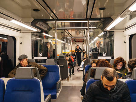 People commuting inside Barcelona train metro trainのeditorial素材