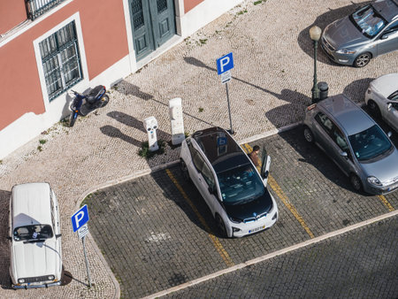 Aerial view of BMW i1 electric car charging in the streets of Lisbon public parking