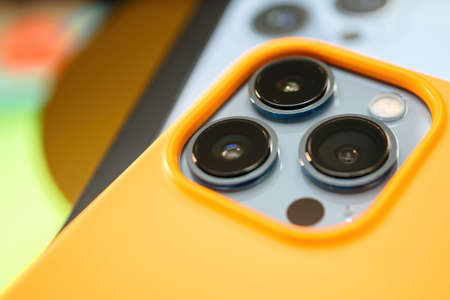 Macro shot of the three cameras Apple Computers iPhone 13 pro during unboxing of the latest telephone mobile device by Appleのeditorial素材