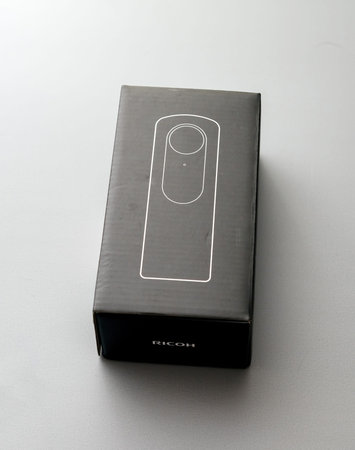View from above at the package cardboard box of Ricoh Theta V4 360 degrees VR camera