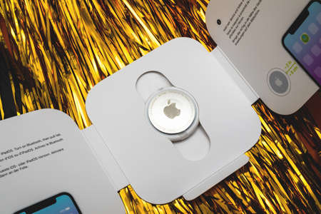 Unboxing of new Apple Computers AirTag device to track lost itemのeditorial素材