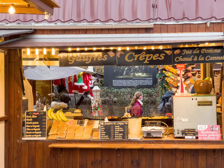 Market stall chalet selling sweet traditional food at the annual famous Capital of Christmasのeditorial素材