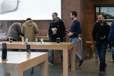 Crowd of people enters Apple Store during latest Apple Computer iPhone