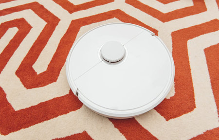 View from above of new operating new robotic vacuum cleaner