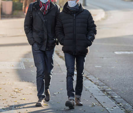 wearing surgical respirator masks - defocused backgroundの写真素材