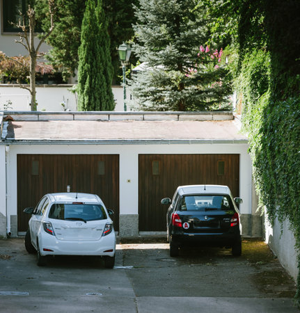 Aerial view of two cars parked in front of two garages - Toyota yaris and Skoda Fabia