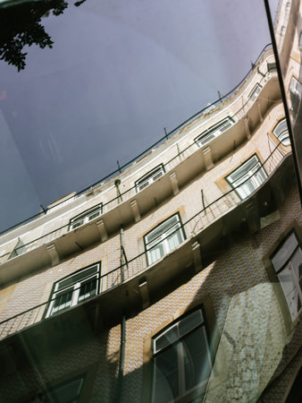 Reflection of apartment building on the car